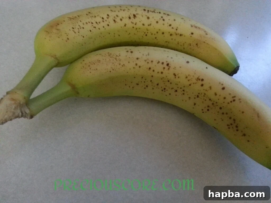 Close-up of ripe bananas, showing dark spots ideal for making sweet and flavorful fritters.