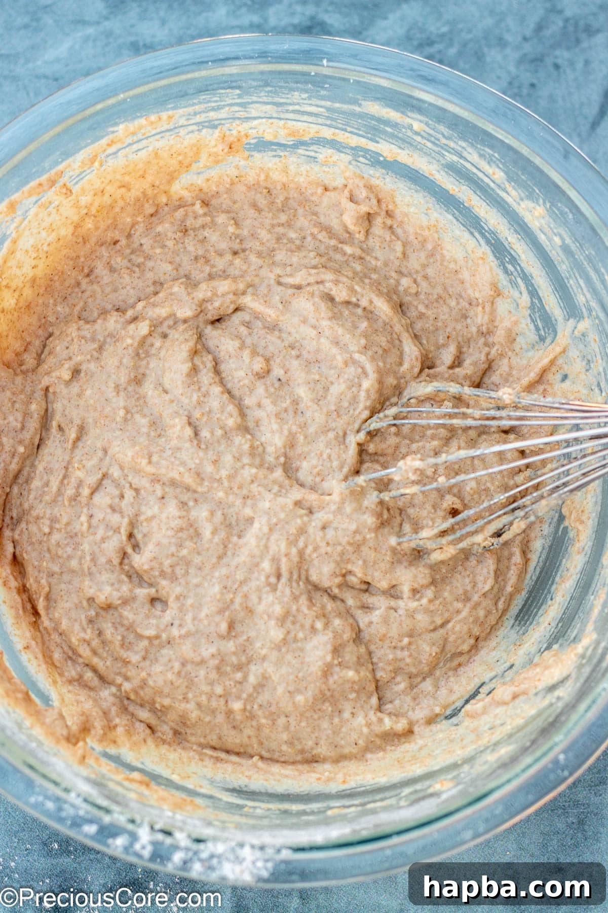 Wholesome Zucchini Applesauce Muffins 8 Wet ingredients for muffins, thoroughly whisked together to a smooth consistency in a bowl.