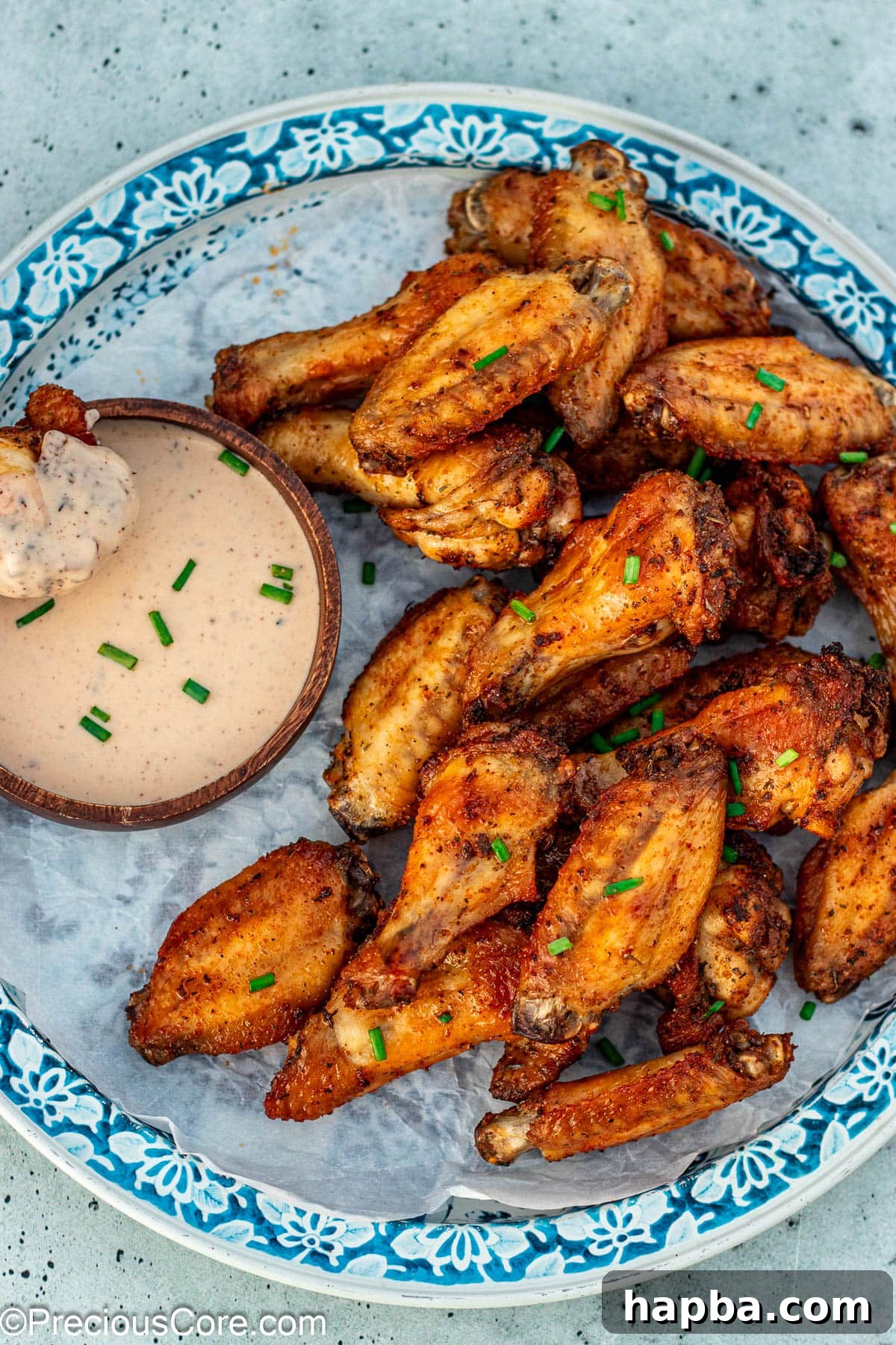 Crispy Baked Dry Rub Wings 8 A baked dry rub chicken wing perfectly coated in creamy ranch dressing, ready to be enjoyed.