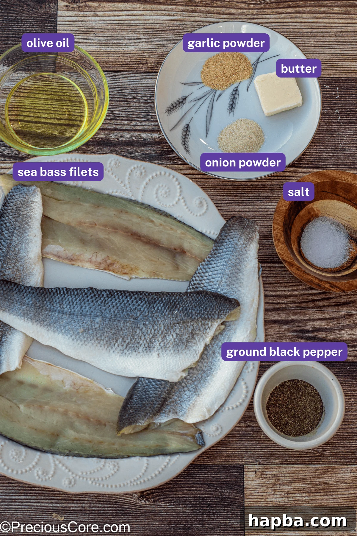 Crispy-Skinned Sea Bass 4 All seven ingredients for Pan Seared Sea Bass laid out: sea bass fillets, olive oil, garlic powder, onion powder, salt, black pepper, and unsalted butter.