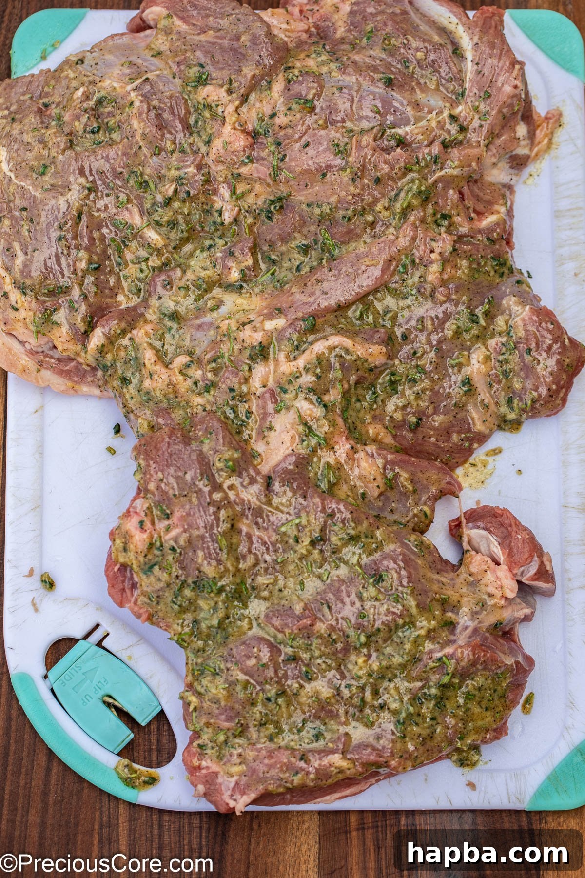 Succulent Boneless Roast Lamb 11 A large piece of lamb meat being brushed with the flavorful marinade.