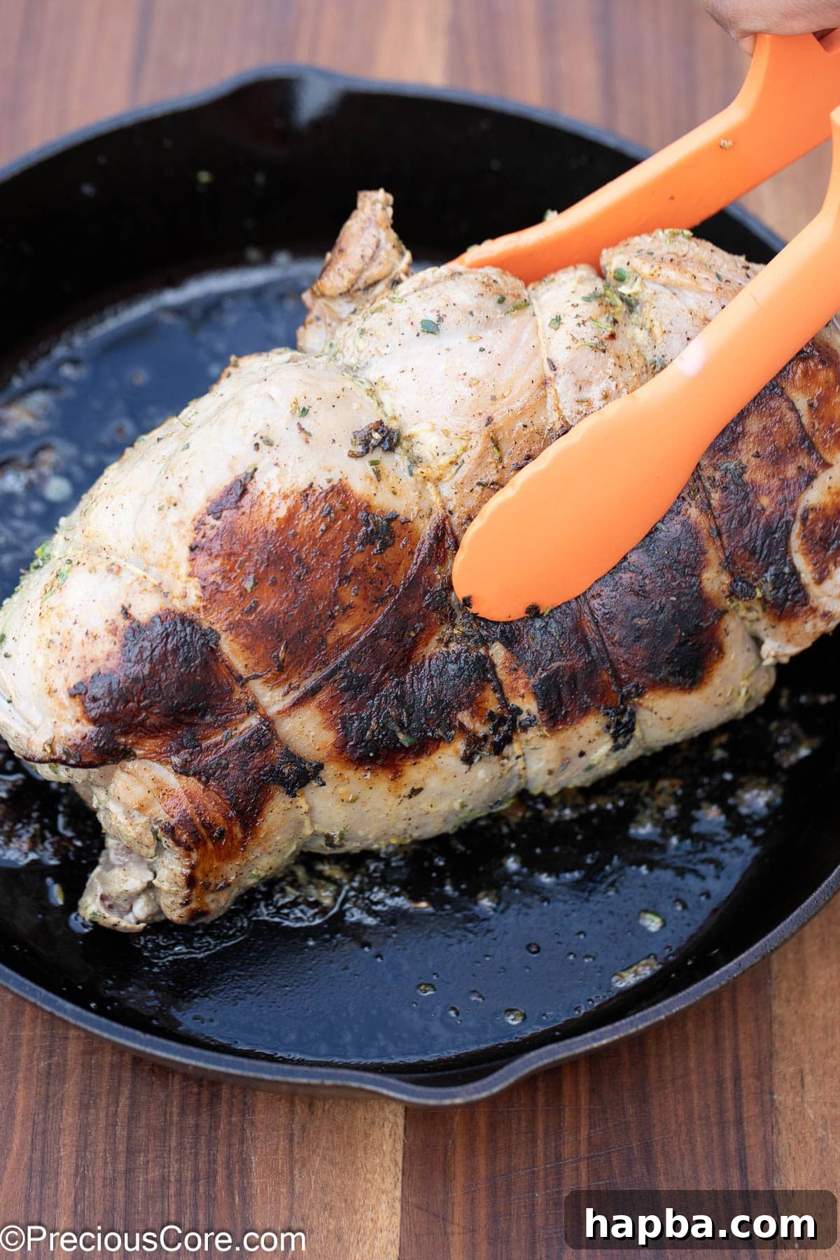 Succulent Boneless Roast Lamb 17 Searing the various sides of the boneless lamb leg for an even crust.