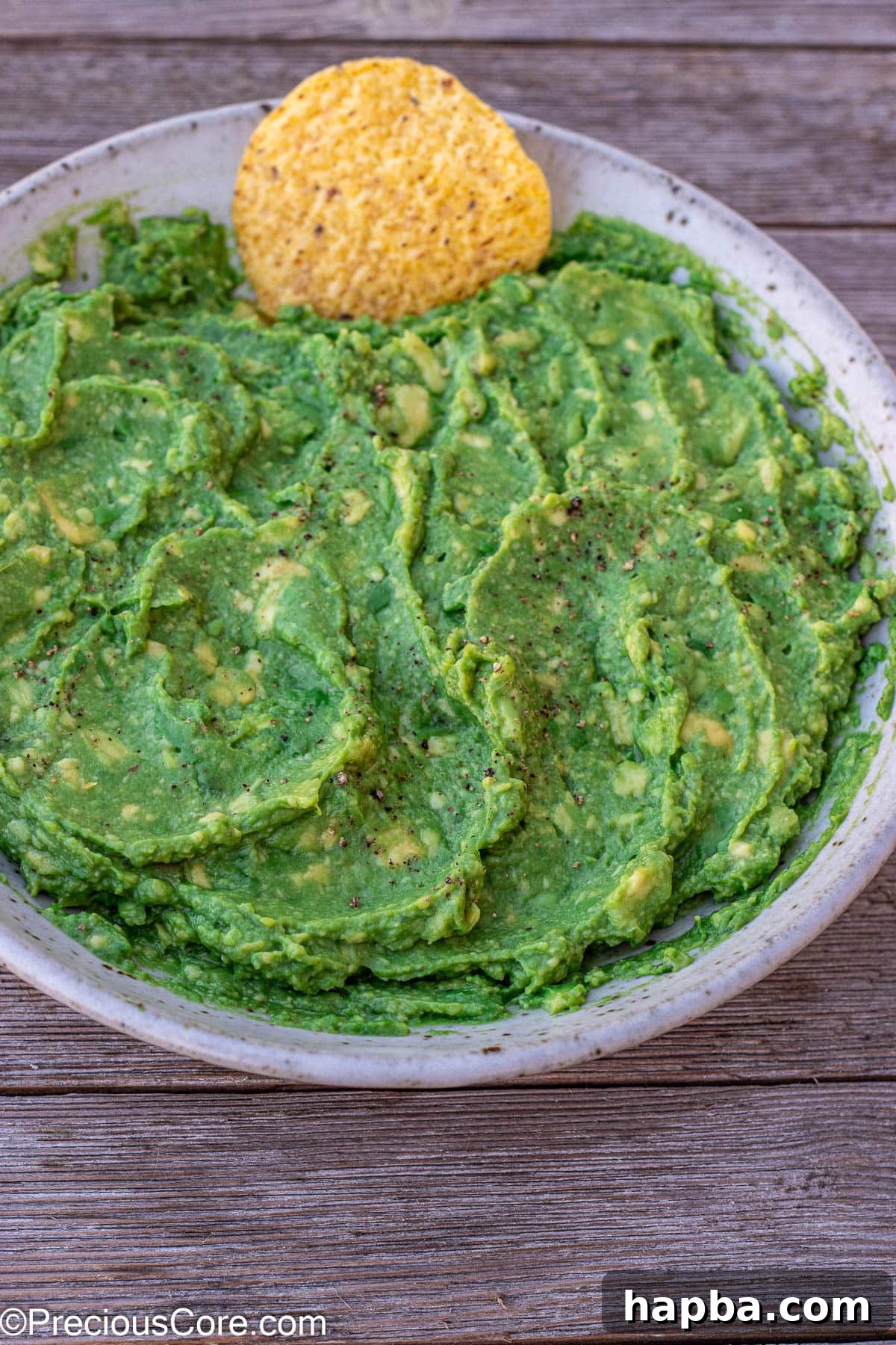 Effortless 4 Ingredient Guacamole 5 A vibrant bowl of 4-ingredient guacamole, perfectly smooth and ready for dipping.