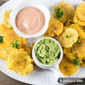 Tostones - twice fried plantains, golden and perfectly crispy.
