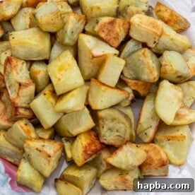 Roasted potatoes on a platter, golden and perfectly seasoned.