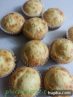 Freshly baked coconut cupcakes in liners