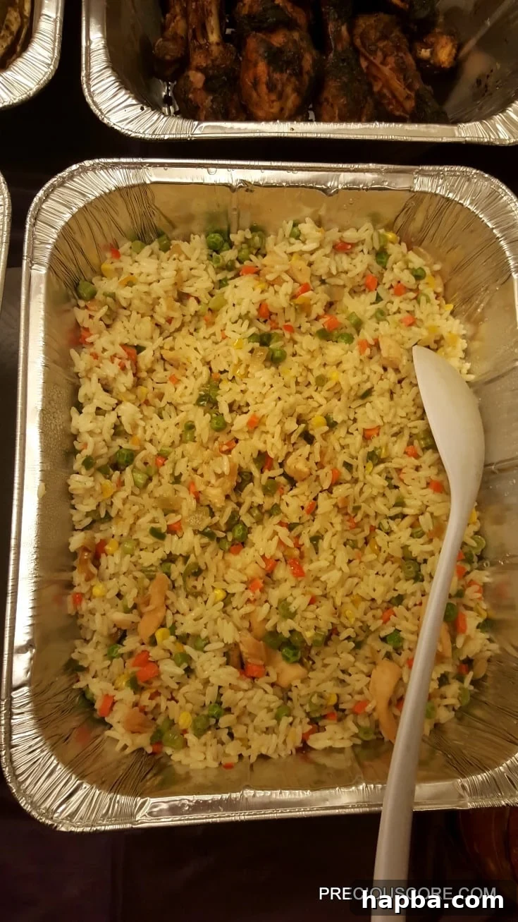 Meeting Update 5 A large pan brimming with fragrant Coconut Fried Rice, ready to serve.