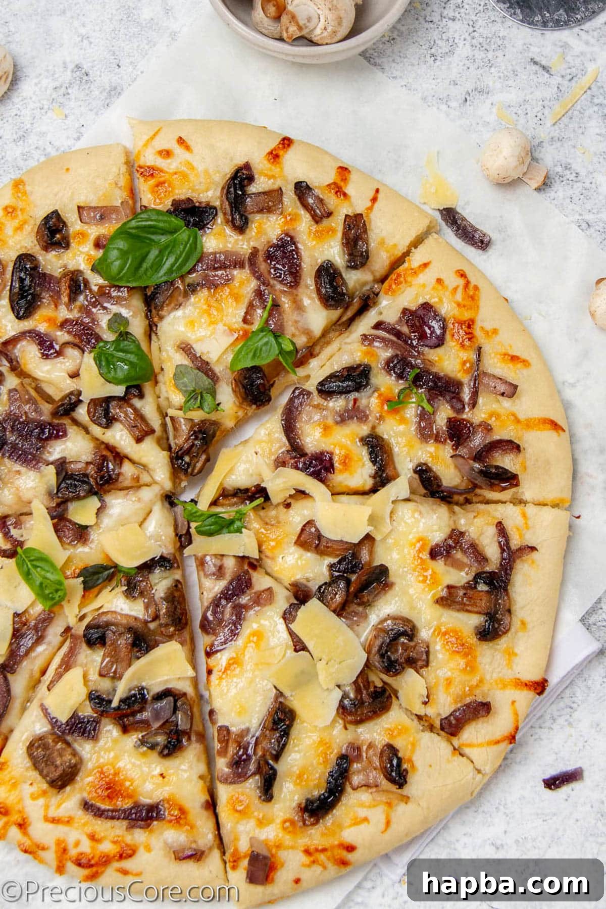Delectable Mushroom Pizza 2 Pizza topped with sautéed mushrooms, caramelized onions, and fresh basil, ready to be served.