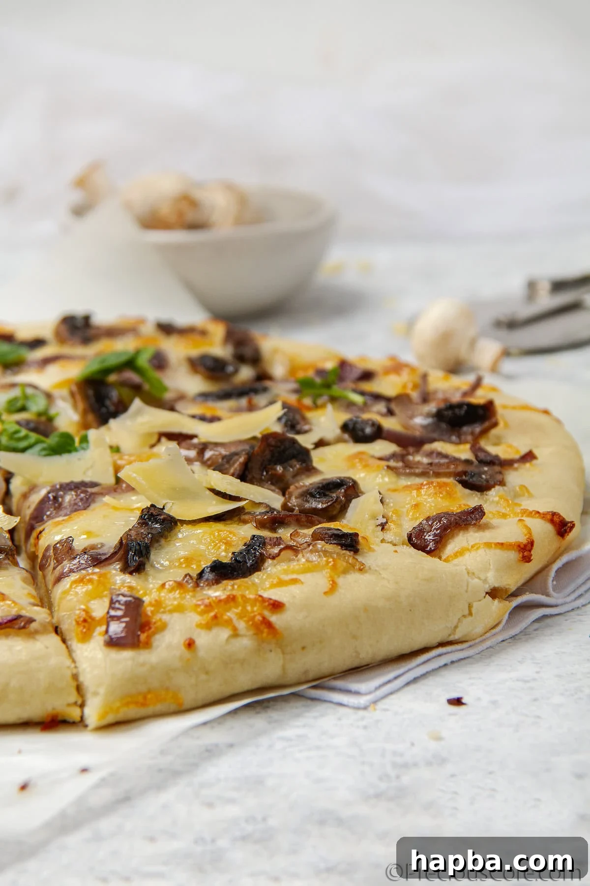 Delectable Mushroom Pizza 5 Close-up of freshly sliced mushrooms and onions, ready for sautéing to top the pizza.