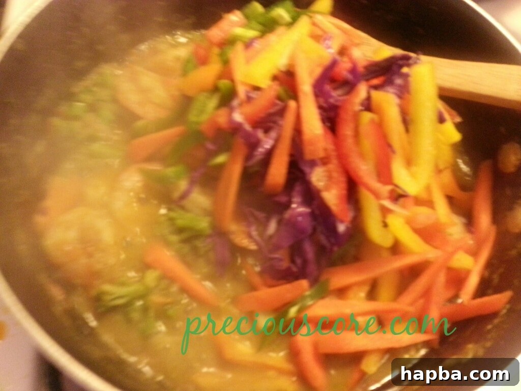 Stir-fry ingredients being tossed together.