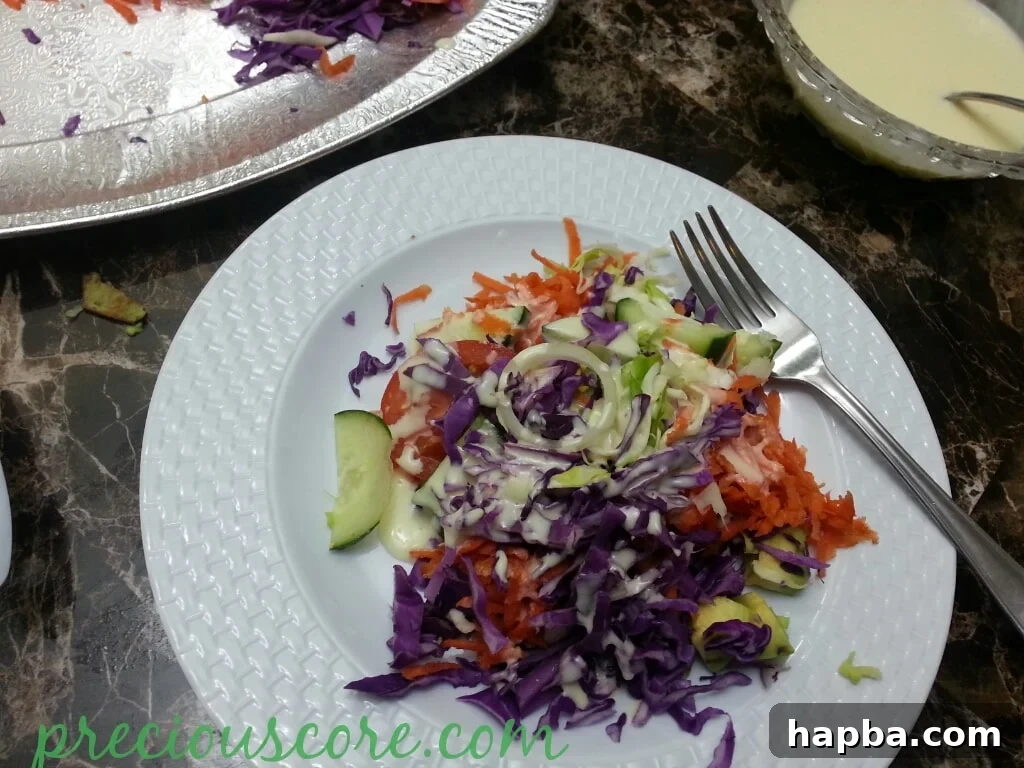 A large serving bowl filled with a fresh, vibrant Cameroon salad, dressed and ready to be enjoyed, showcasing a medley of colorful vegetables.