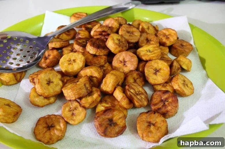 Fried plantains on a paper towel.