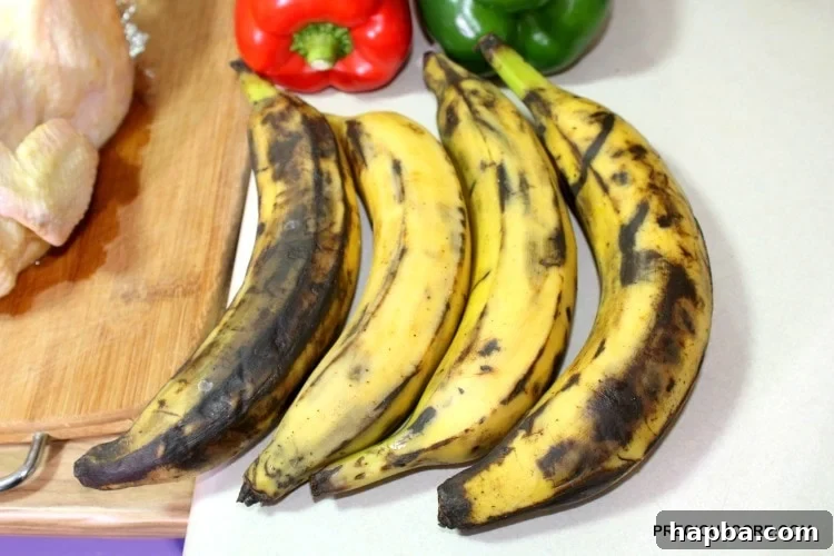 Brown plantains with peppers on a counter.