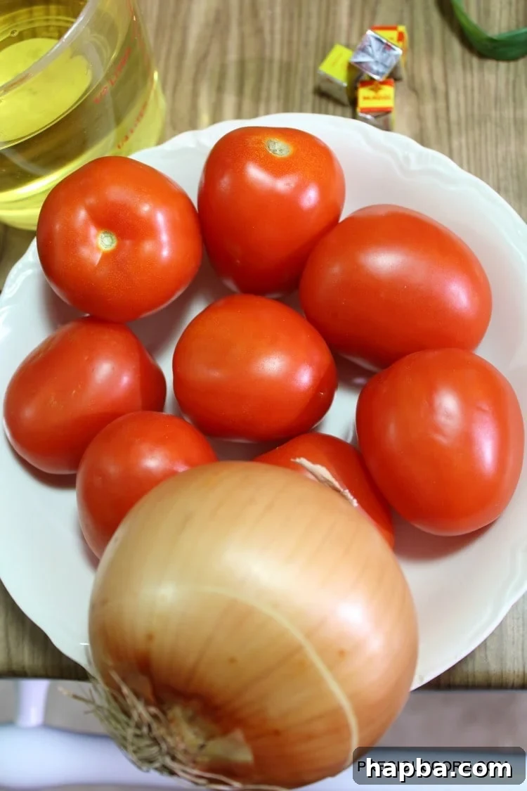 Tomatoes and onion in a bowl.