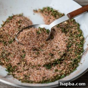 A spoon grabbing some of the best seasoning for French fries.