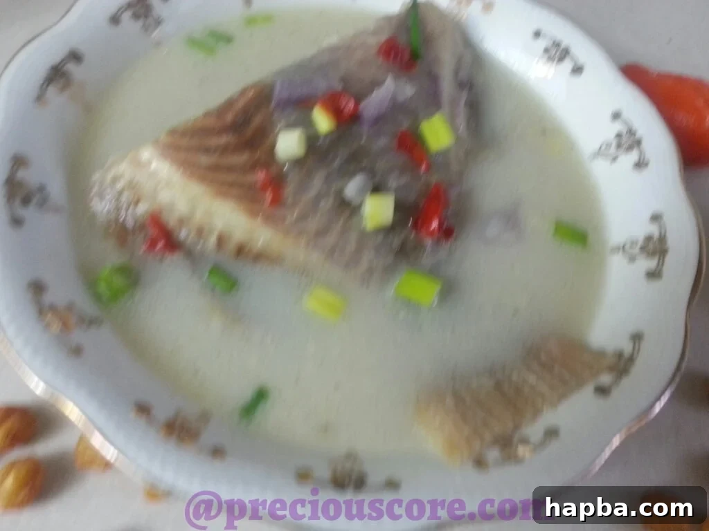 Ingredients laid out for Cameroonian Fish Pepper Soup preparation.
