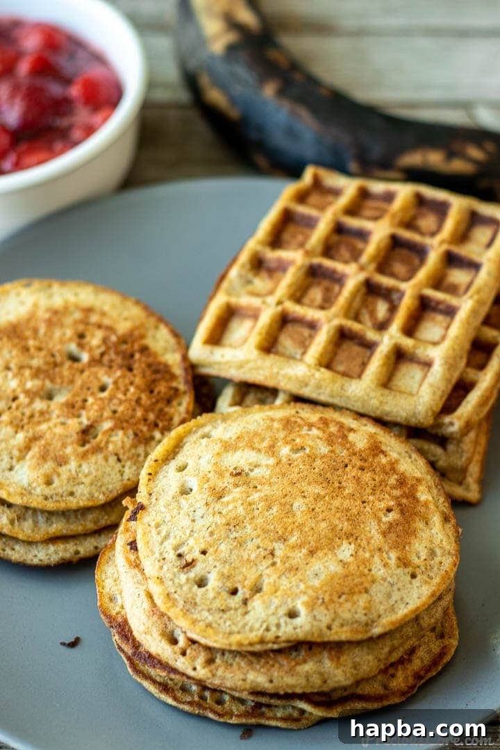 A serving plate showcasing both fluffy plantain pancakes and perfectly golden plantain waffles, offering a versatile breakfast option.