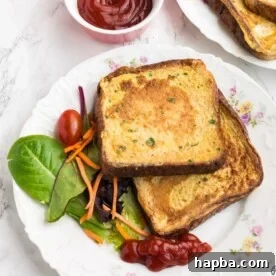 A plate featuring slices of Savory French Toast, demonstrating its appealing golden-brown finish.