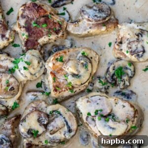 Cooked pork tenderloin in a creamy sauce with mushrooms.
