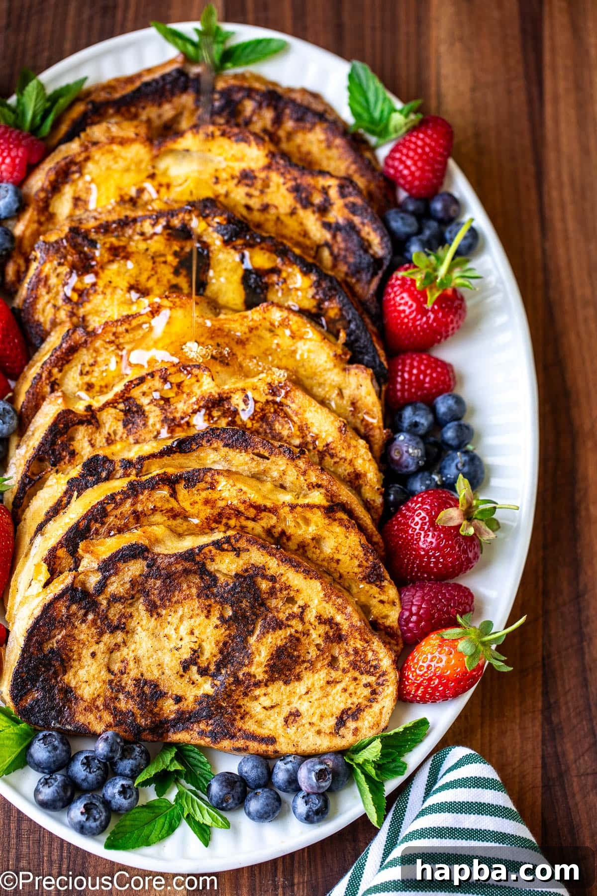 Sourdough French Toast served with fresh berries and syrup.
