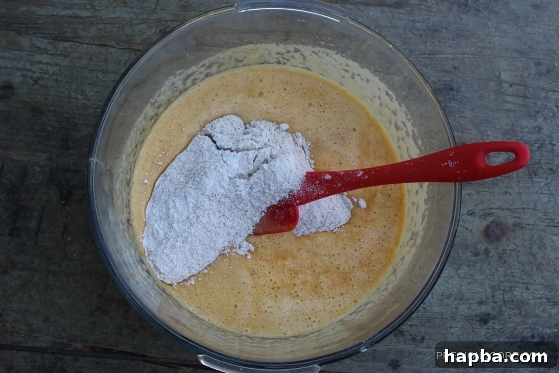 Autumn Spiced Pumpkin Roll 9 Wet and dry cake ingredients together in a mixing bowl, prior to full incorporation.