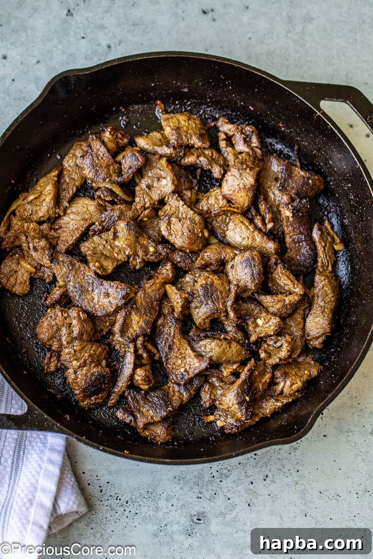 Restaurant-Style Beef Shawarma at Home 8 Perfectly cooked beef shawarma resting in a cast iron pan.