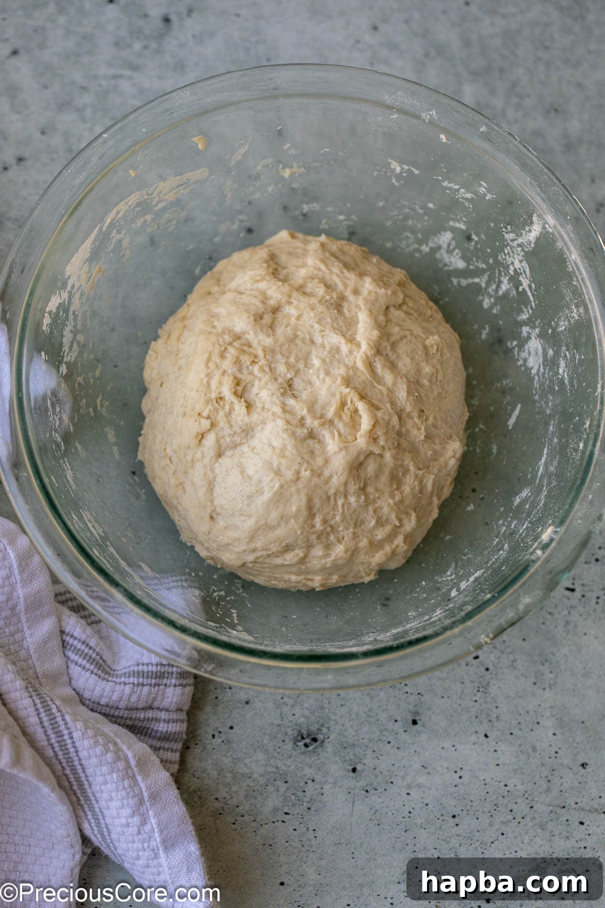 Shawarma Flatbread 6 The dough, after its initial kneading, resting comfortably in a bowl and covered, signifying the important relaxation phase.