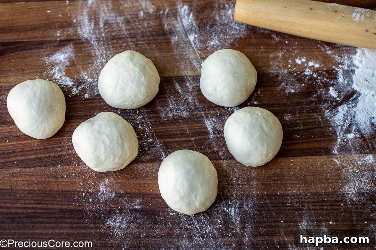 Shawarma Flatbread 8 The dough neatly divided into six uniform balls, prepared for rolling.