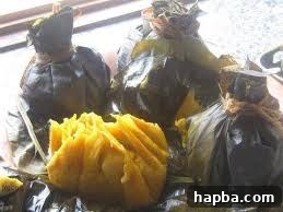 Mami Koki and Plantains: A Cameroonian Delicacy A close-up shot of Mami Koki, a traditional Cameroonian dish made from steamed black-eyed peas, wrapped in banana leaves, often served with boiled plantains or bananas. It looks delicious and comforting.