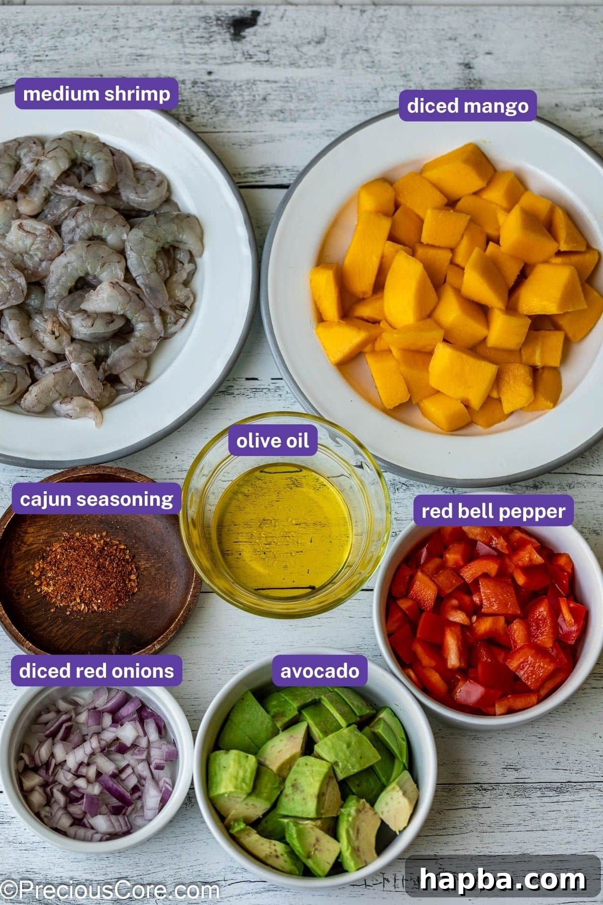 Tropical Mango Shrimp Salad 3 A visual guide to the fresh ingredients required for Mango Shrimp Salad, including diced mango, cooked shrimp, ripe avocado, and colorful bell peppers.
