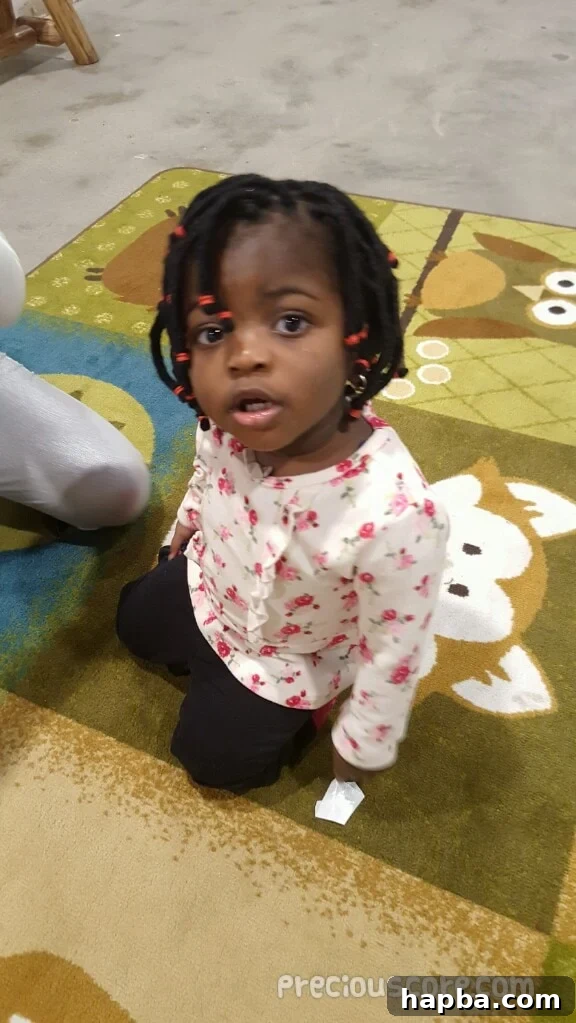 toddler with newly braided hair, a rare and cherished moment