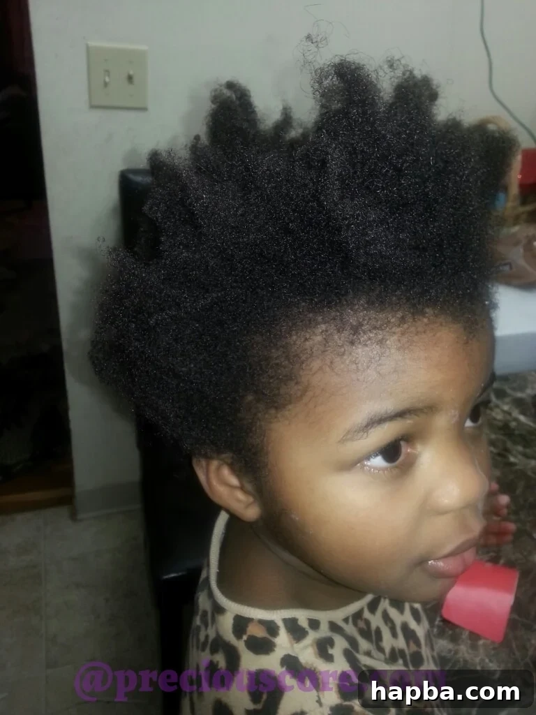 Girl two's beautiful afro before styling
