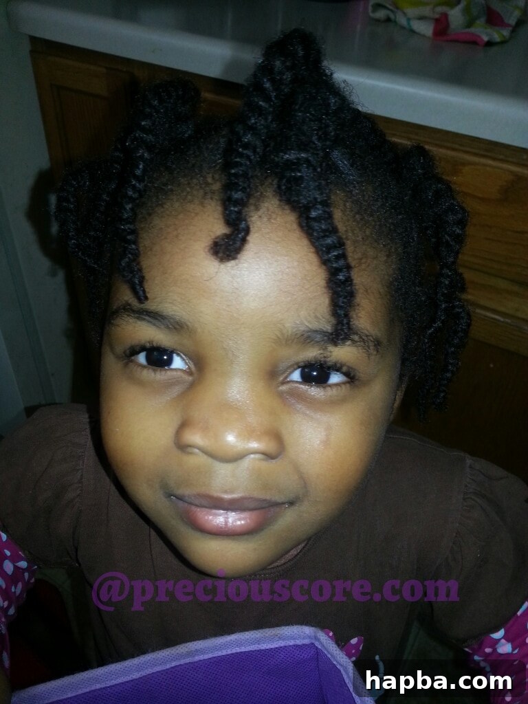 Girl two with bigger natural hair twists