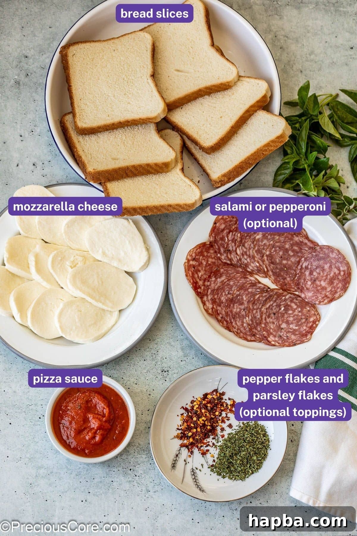 A vibrant flat lay of all the essential ingredients needed to make pizza toast, including bread, sauce, cheese, and pepperoni.