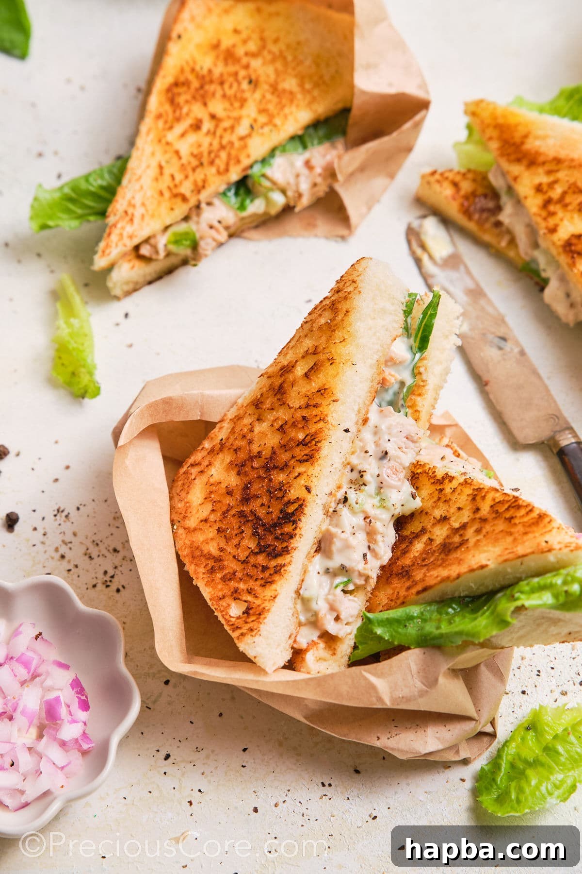 Classic Creamy Chicken Sandwich 2 Chicken Mayonnaise Sandwiches cut into triangles, beautifully arranged on a platter.