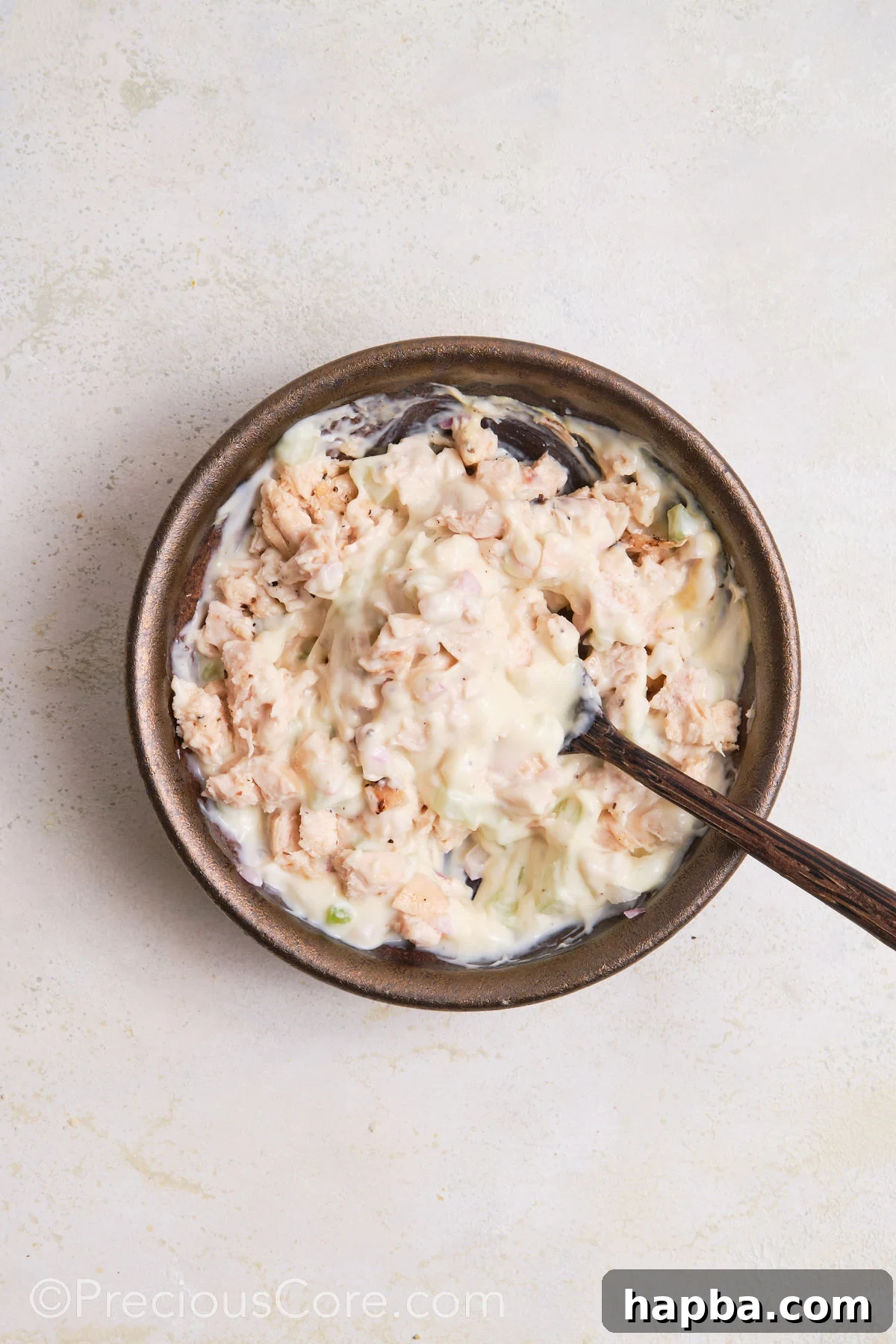 Classic Creamy Chicken Sandwich 11 The completed chicken mayonnaise sandwich filling, perfectly mixed and ready for assembly, in a bowl.