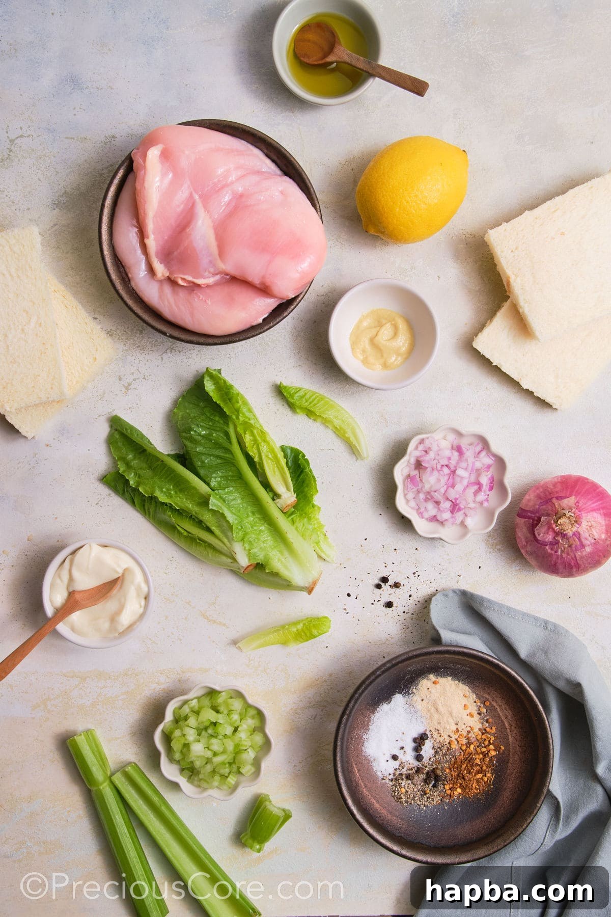 Classic Creamy Chicken Sandwich 5 A vibrant collection of ingredients laid out, ready for making a delicious chicken sandwich with mayo.