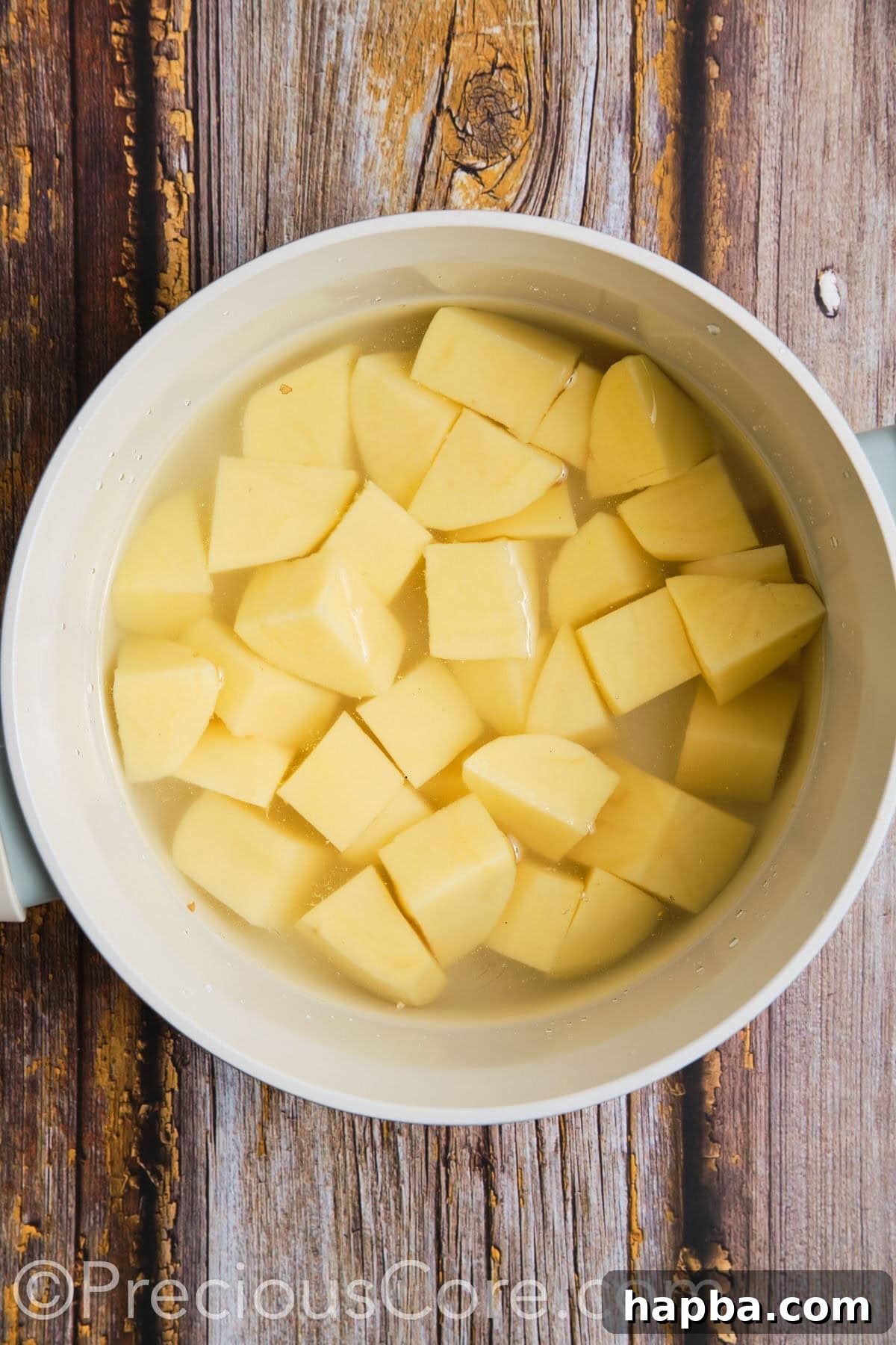 Cut potatoes in a pot of water.