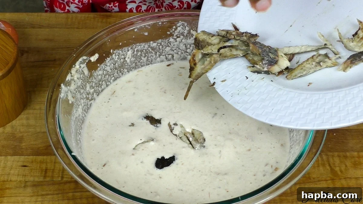Tying egusi pudding bundles for steaming