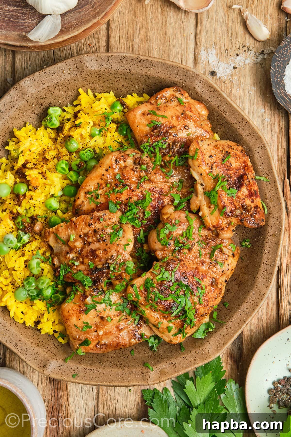 Pan Seared Boneless Chicken Thighs with yellow rice.