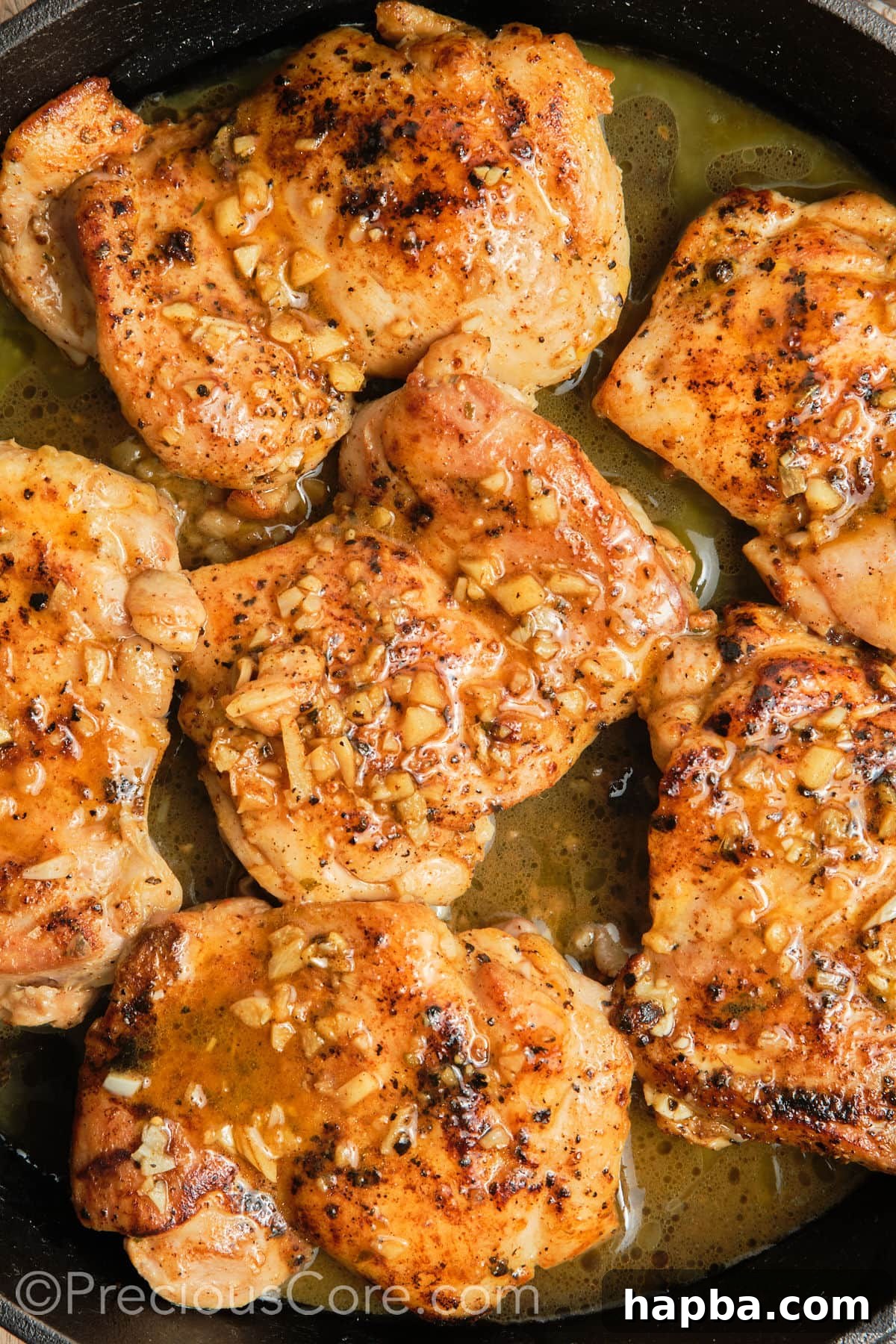 Cooked Pan Seared Boneless Chicken Thighs.