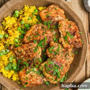 Pan Seared Boneless Chicken Thighs with yellow rice.