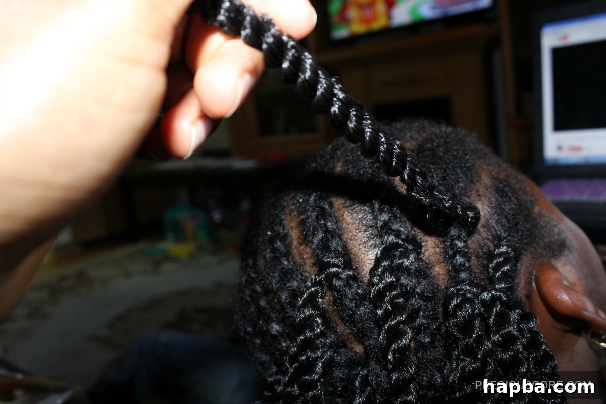 Securing crochet braid by feeding hair through the loop and tightening