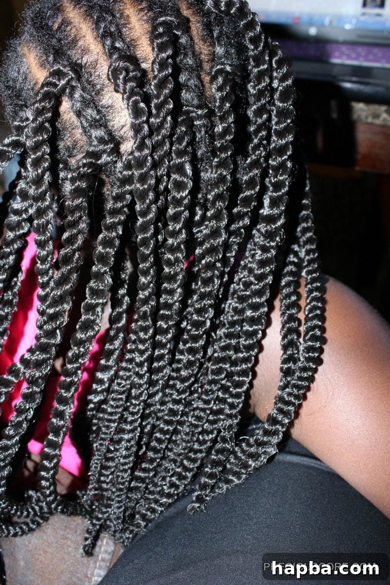 Completed section of crochet braids on a child's head
