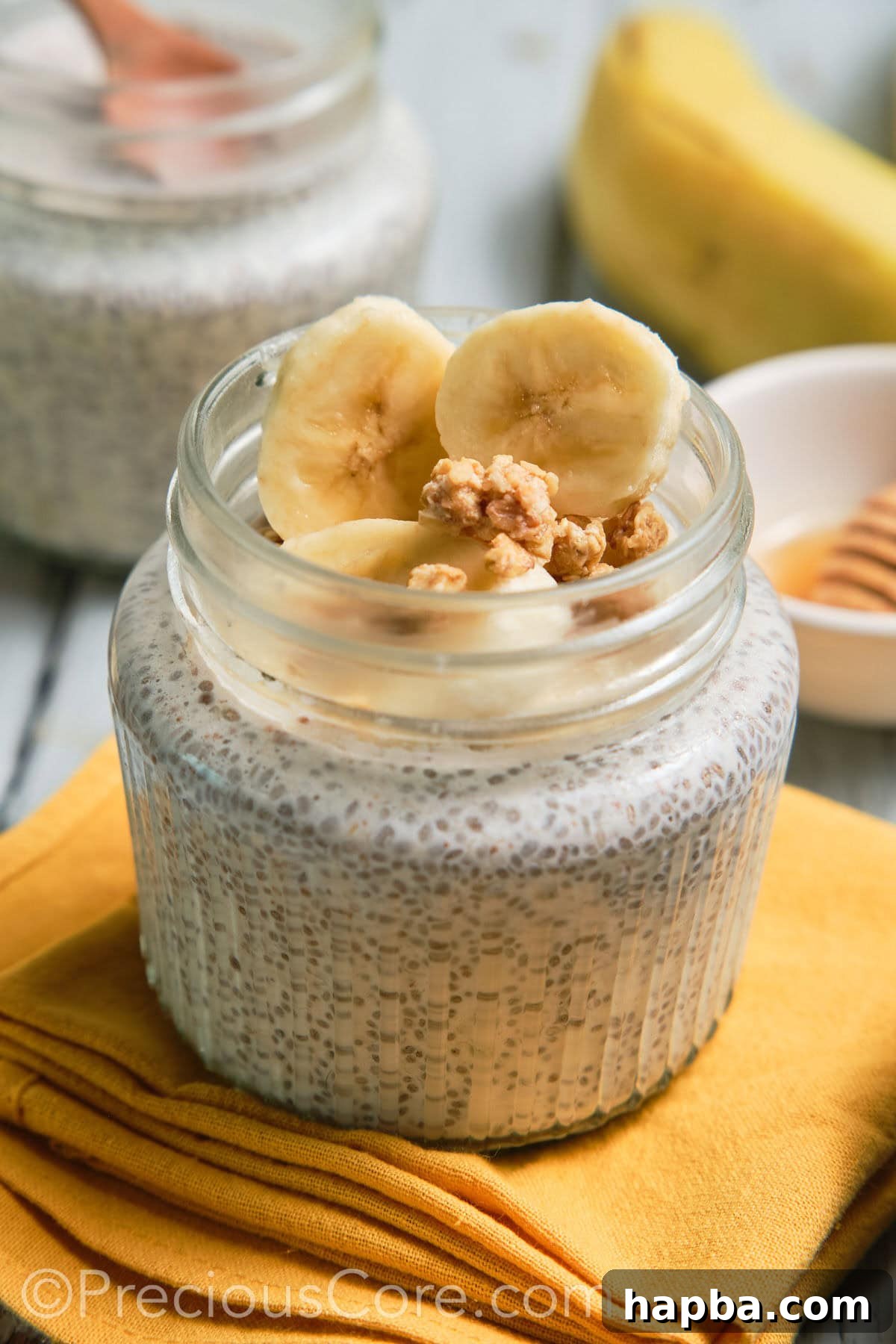 Close-up of a jar of banana chia pudding, showcasing its creamy texture and healthy appeal.