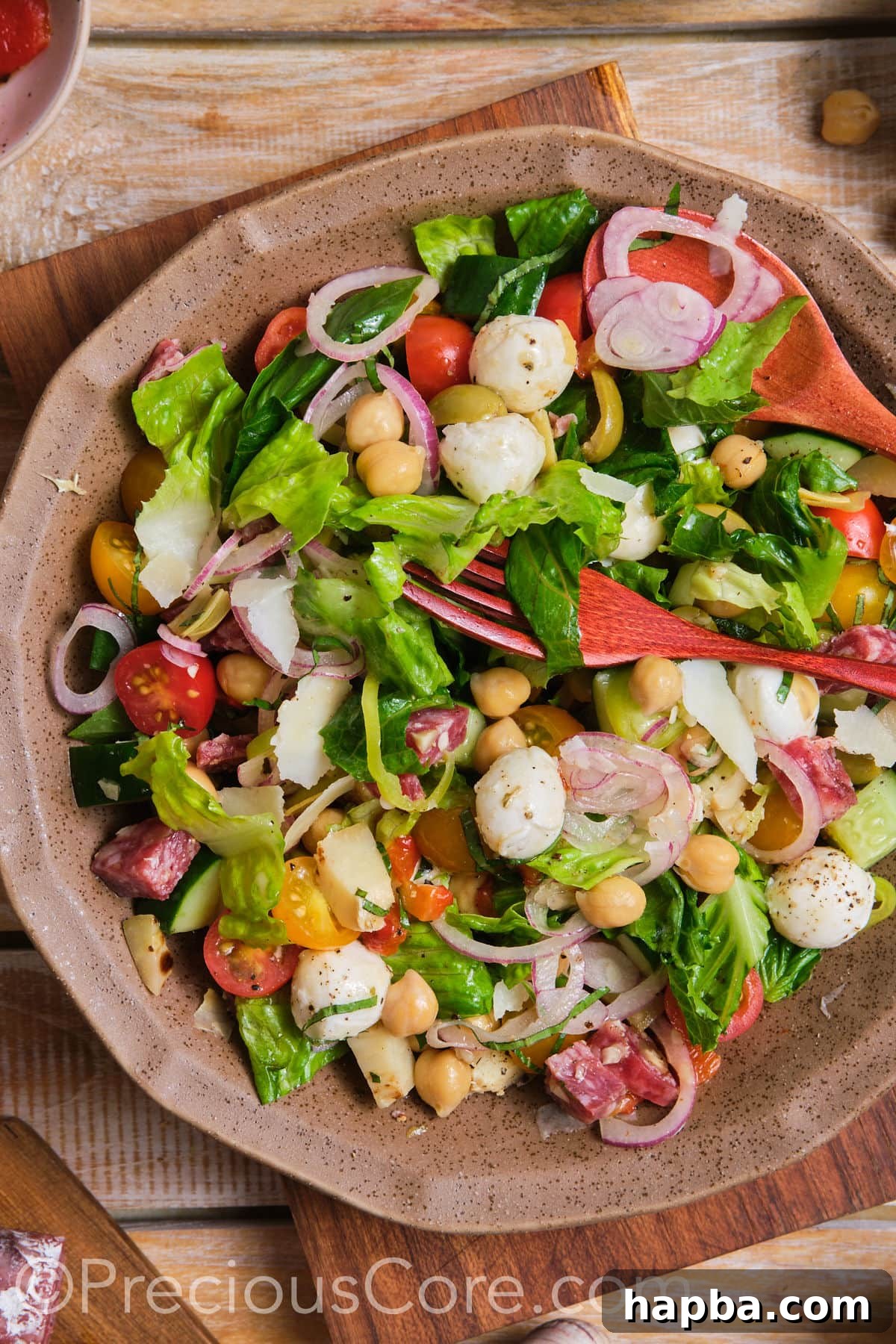 A beautifully presented bowl of Italian chopped salad, showcasing its vibrant colors and diverse ingredients.