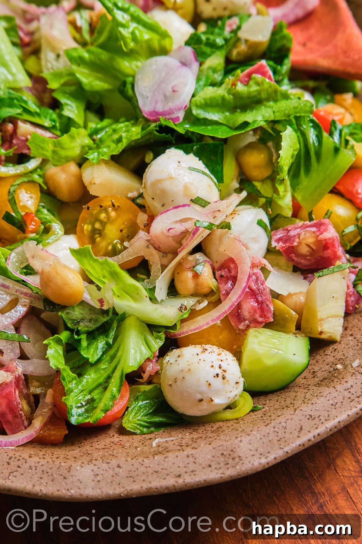 A close-up view of the appetizing Italian chopped salad, highlighting its rich textures and vibrant colors.