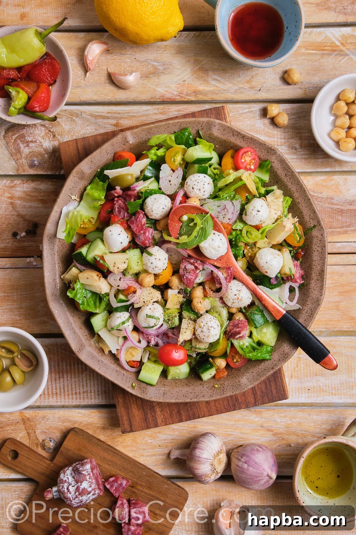 A large bowl filled with freshly prepared chopped salad, featuring a mix of colorful ingredients.