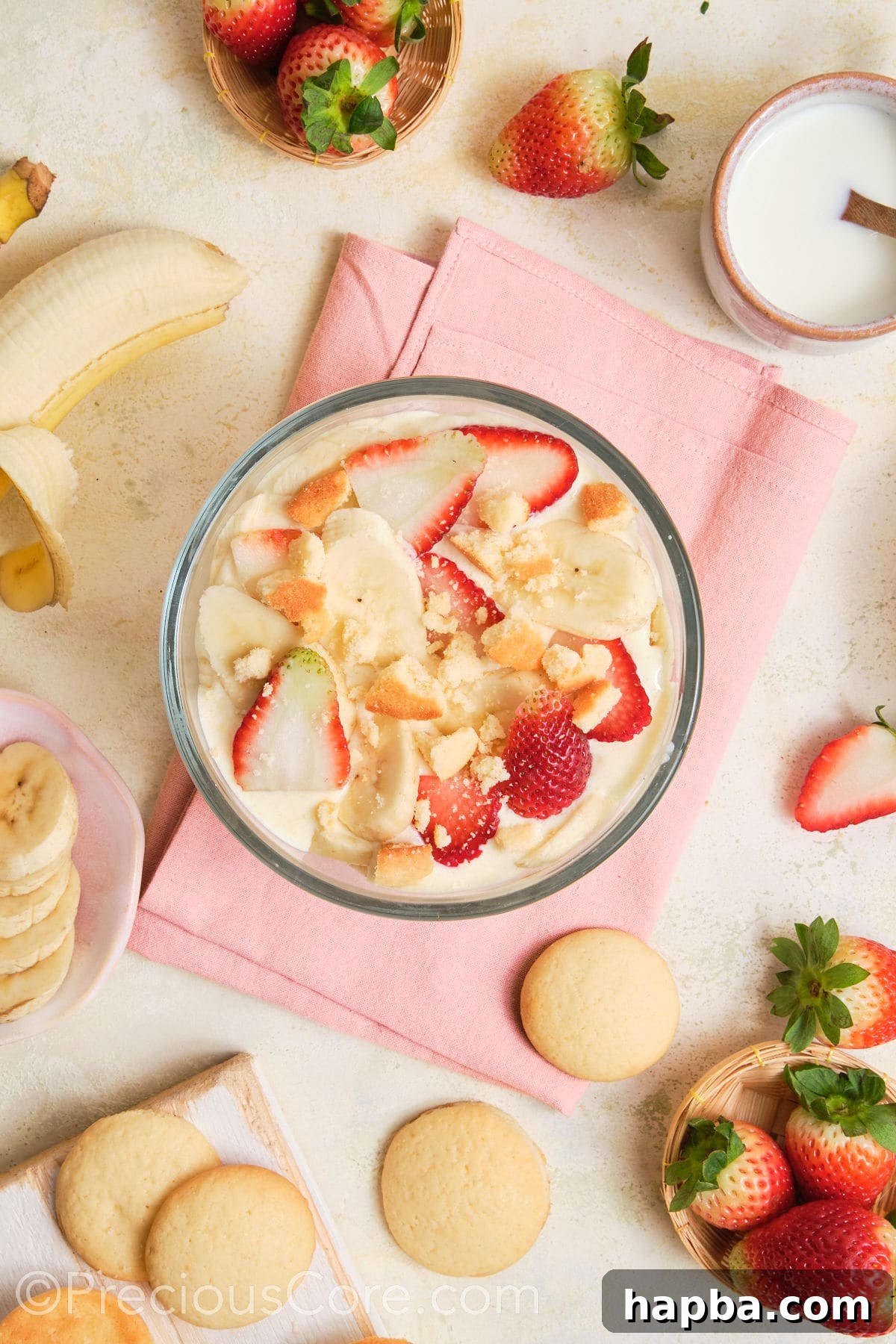 Crushed vanilla wafer cookies added to strawberry banana pudding.