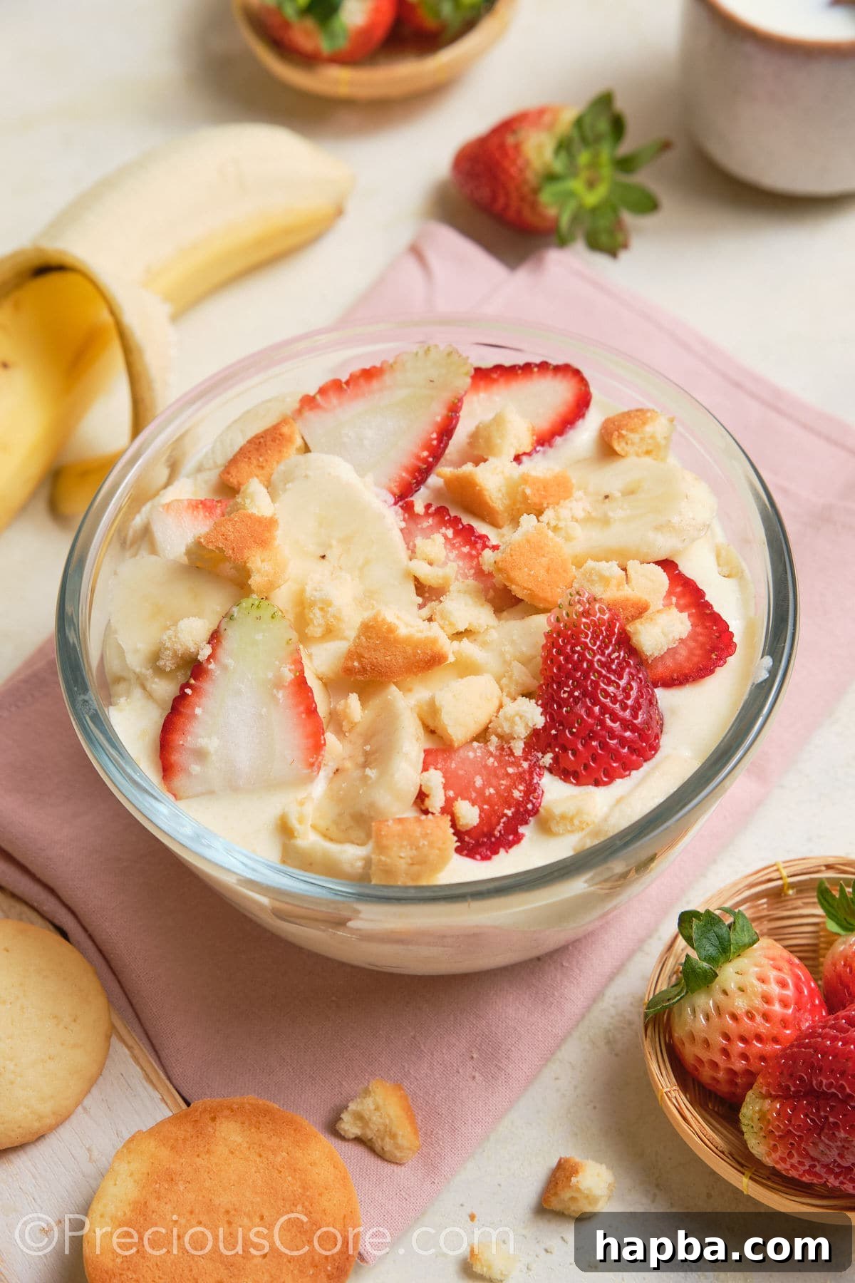 White pudding topped with strawberries and bananas.